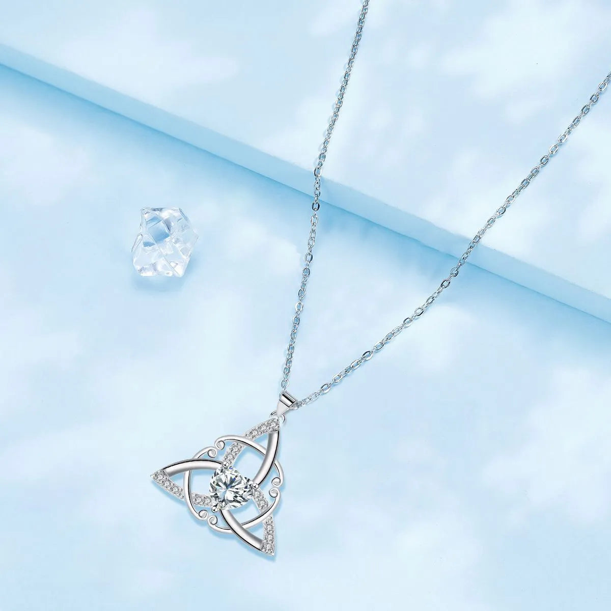 Geometric Celtic knot pendant necklace for women in copper with a choice of coloured electroplated finishes.