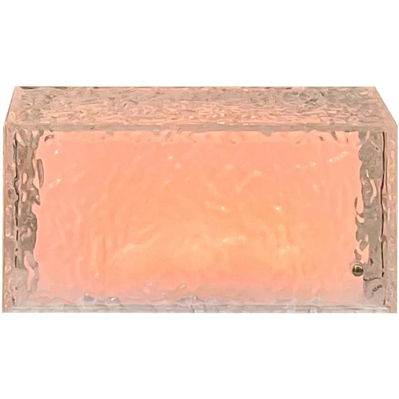 Clear acrylic geometric ice cube shaped night light with colour changing LED lights inside.