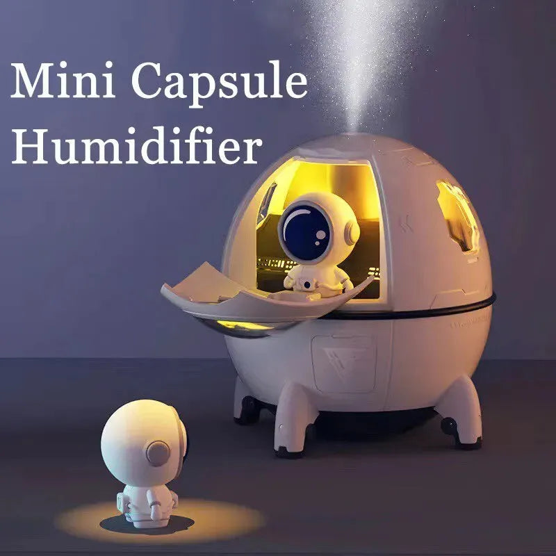 Light purple astronaut-shaped USB humidifier with 220ml tank and colourful LED light on desktop