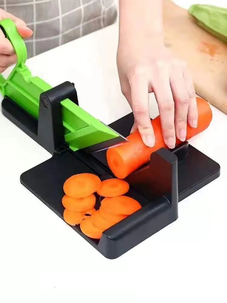 Green and red plastic vegetable cutter with stainless steel blades for carrots and potatoes