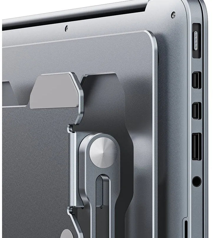 Grey aluminium adjustable laptop stand folded and unfolded on a wooden desk