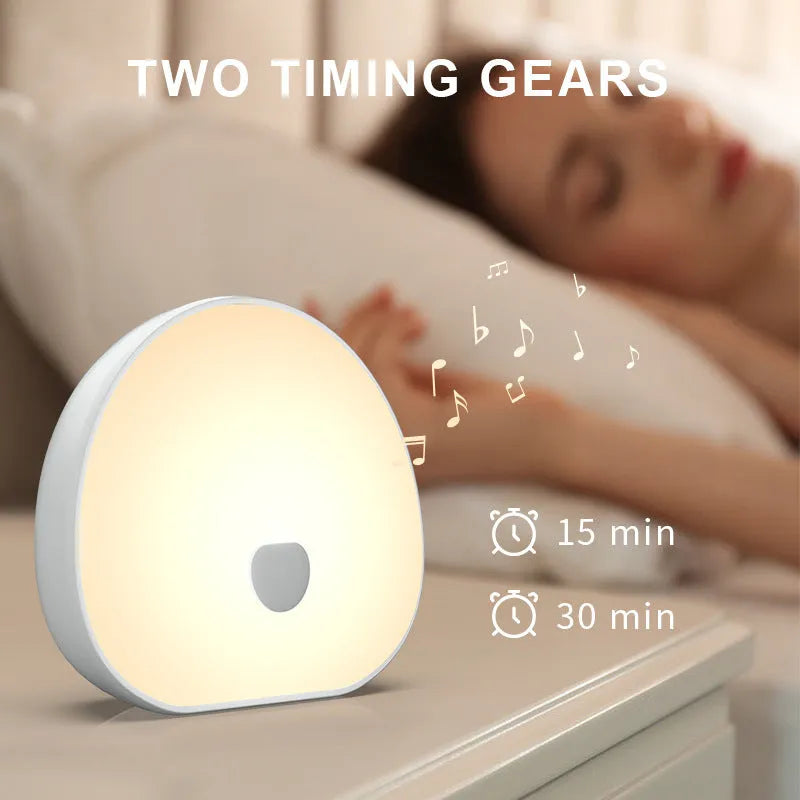 White rechargeable baby feeding comforter with music function for overnight infant care