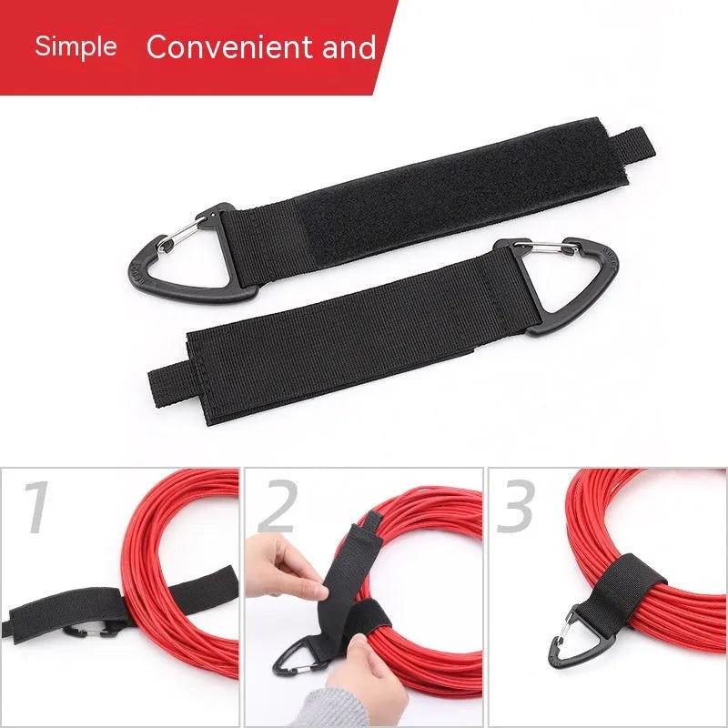 Black heavy-duty gravity storage strap with metal carabiner hook for garages and outdoor travel