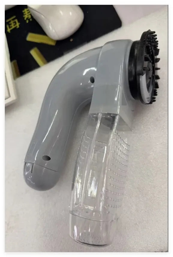 Grey portable electric pet hair vacuum cleaner with soft rubber grooming head