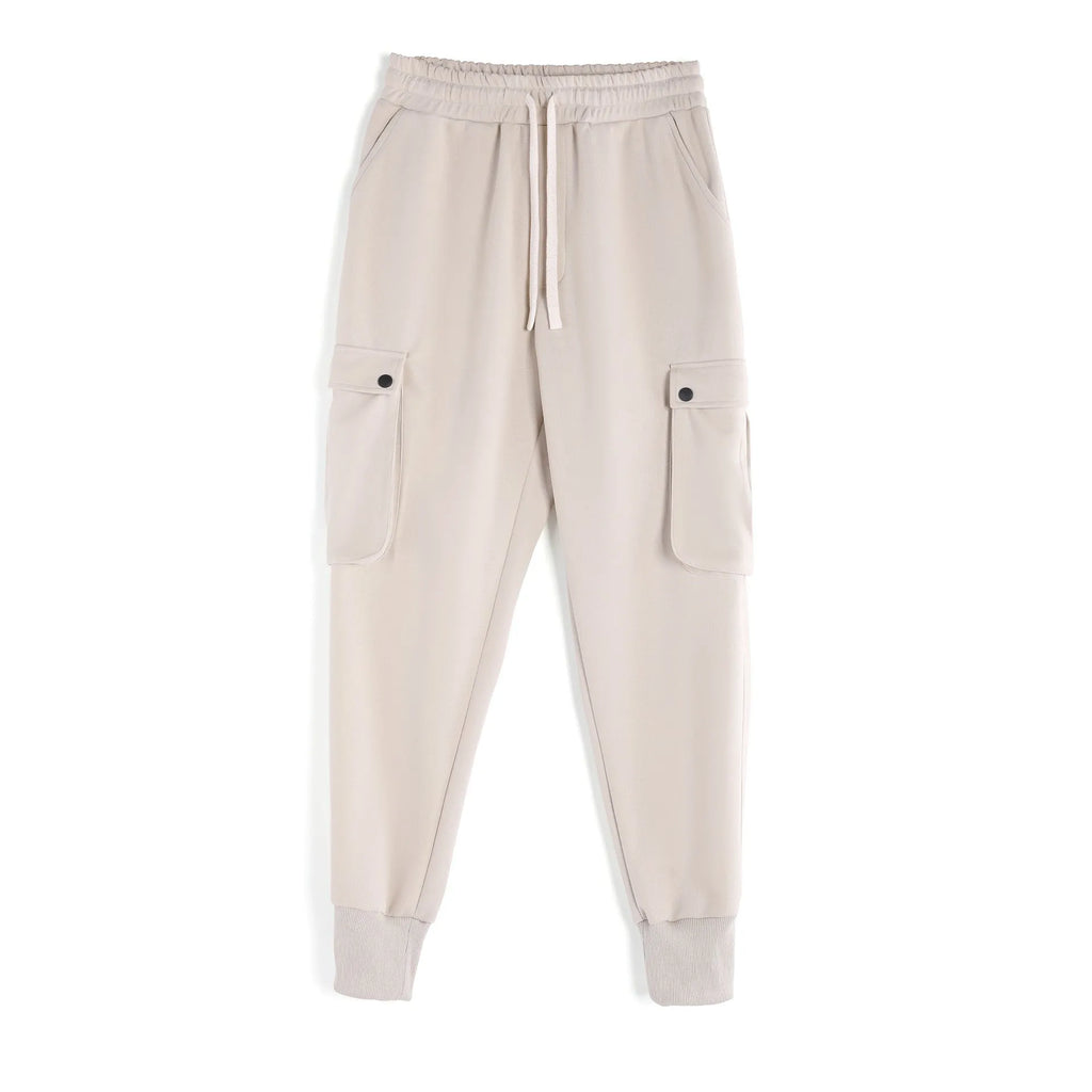 Men's loose cotton sports trousers with ankle tie closure and multiple pockets in solid colour