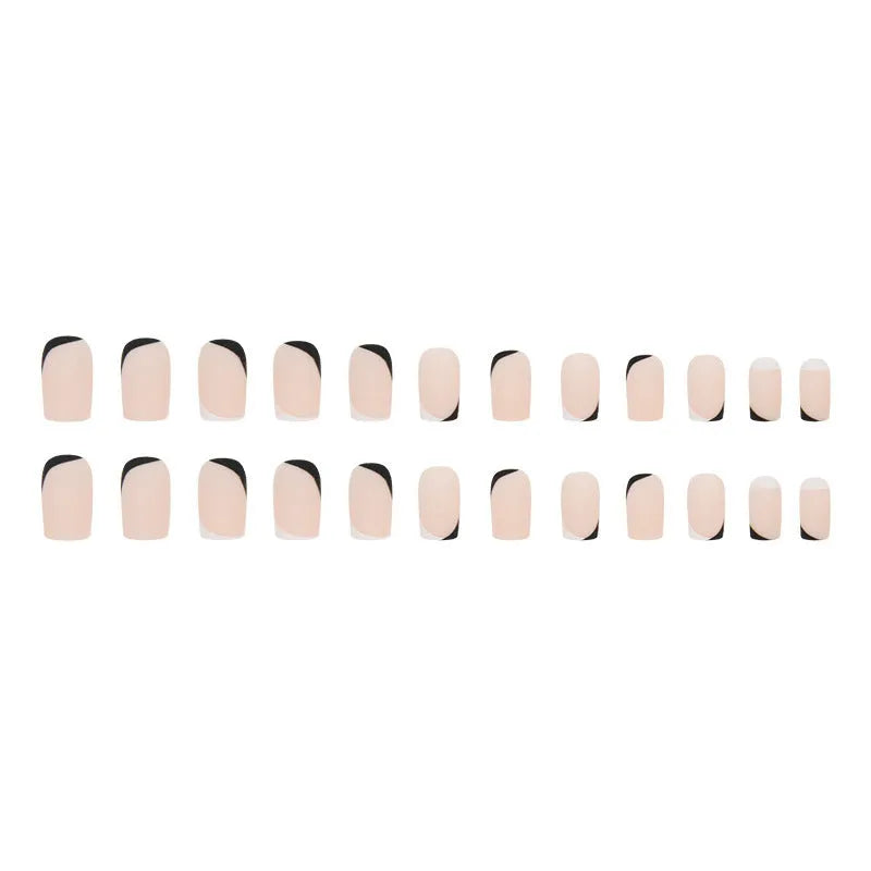 Black and white frosted French manicure artificial nails on display