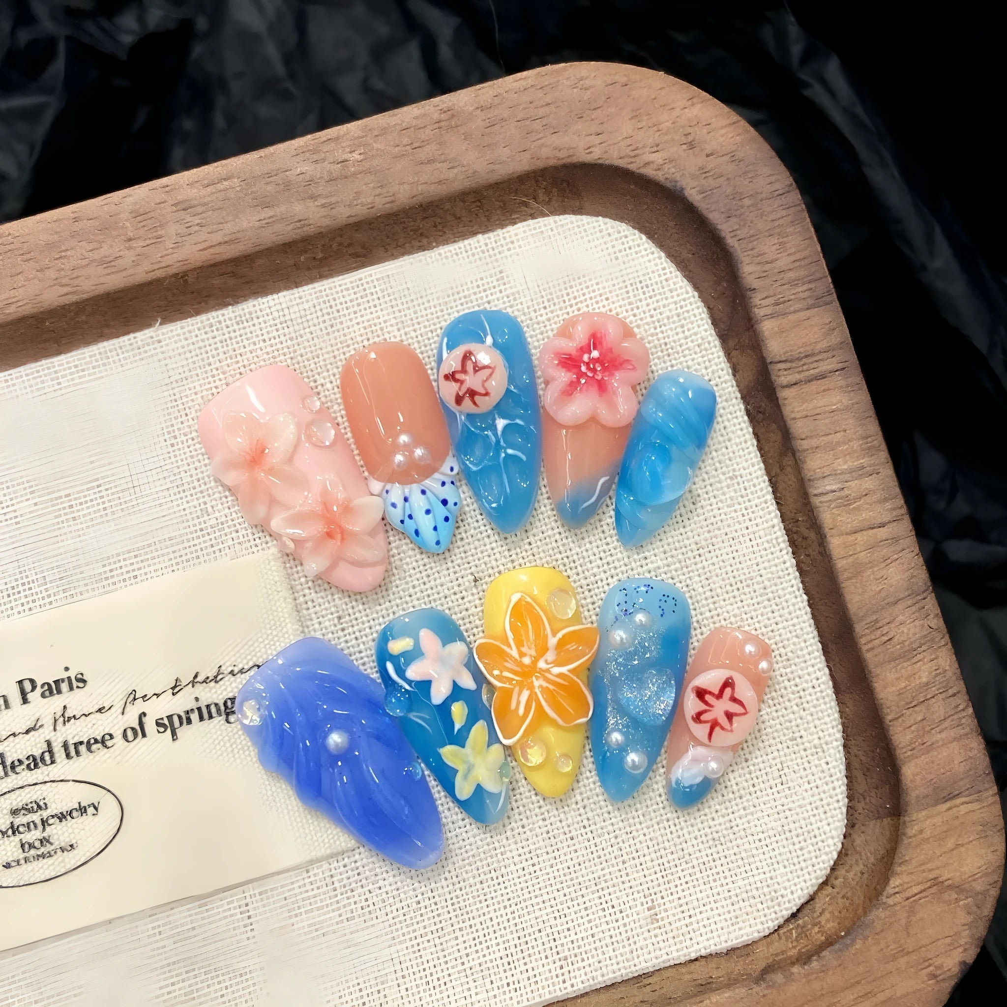 Three-dimensional carved jellyfish design plastic wearable armour set in almond nail colour