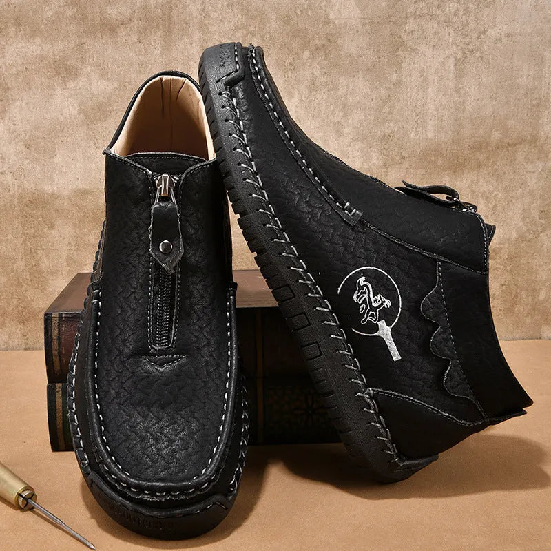 Men's black slip-on loafers with a round toe and rubber sole, shown in a casual style.