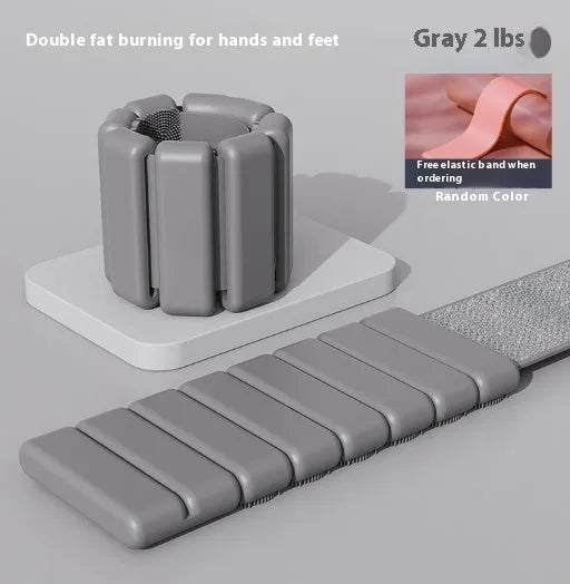 Silicone fitness weight bracelet with Velcro strap shown in black, blue, grey, or pink.