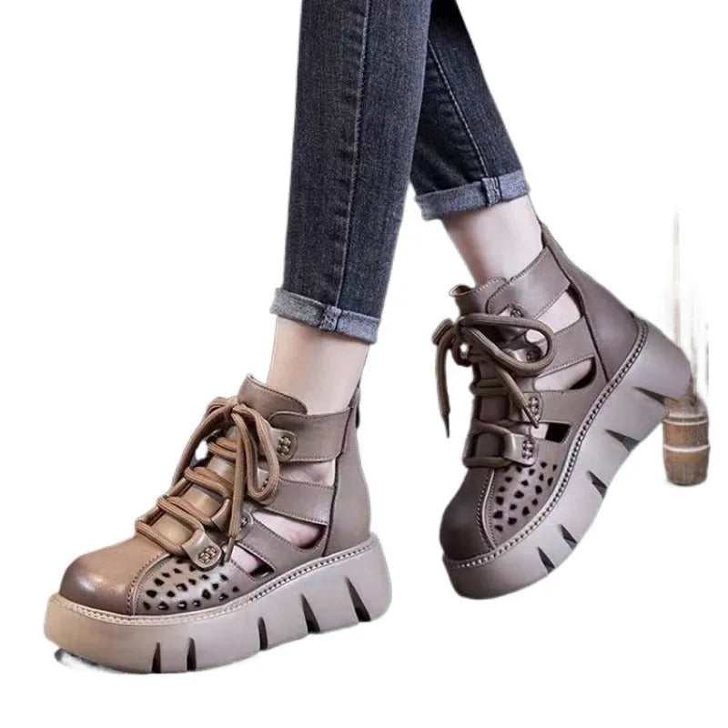 Women's black platform sandals with hollow hole design and fish mouth toe in soft cowhide leather.