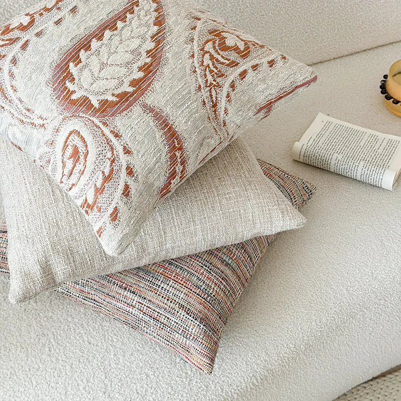 American-style jacquard cushion cover with a paisley and floral pattern in an amber colour.