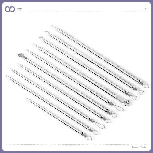 Four silver metal acne needles and a handling clip laid out on a clean surface.