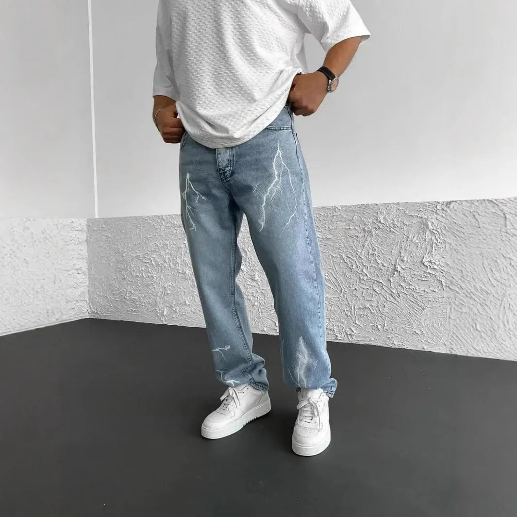 Men's blue straight-leg loose wide-leg denim jeans on a neutral background