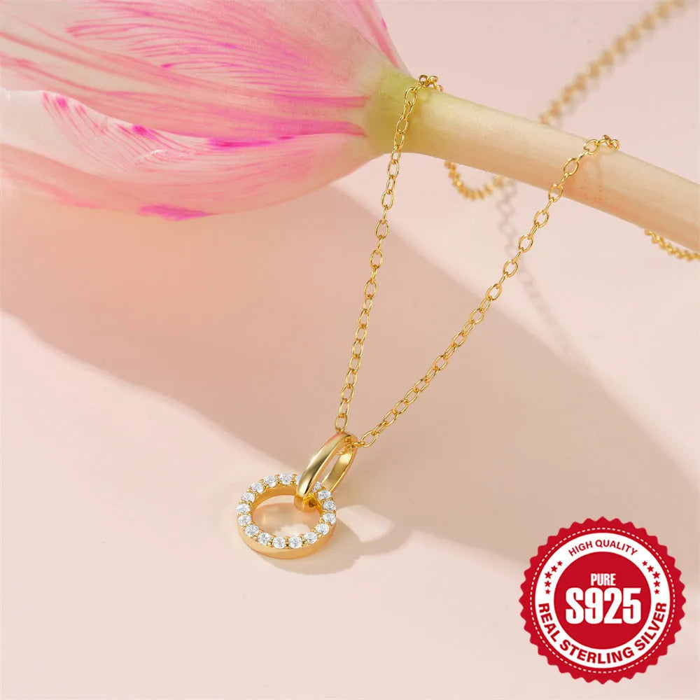 Gold-coloured S925 sterling silver clavicle chain with an interlocking geometric zircon pendant.