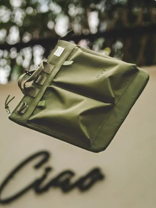 Canvas messenger bag with retro style, shoulder strap, and open showing 15-inch laptop compartment