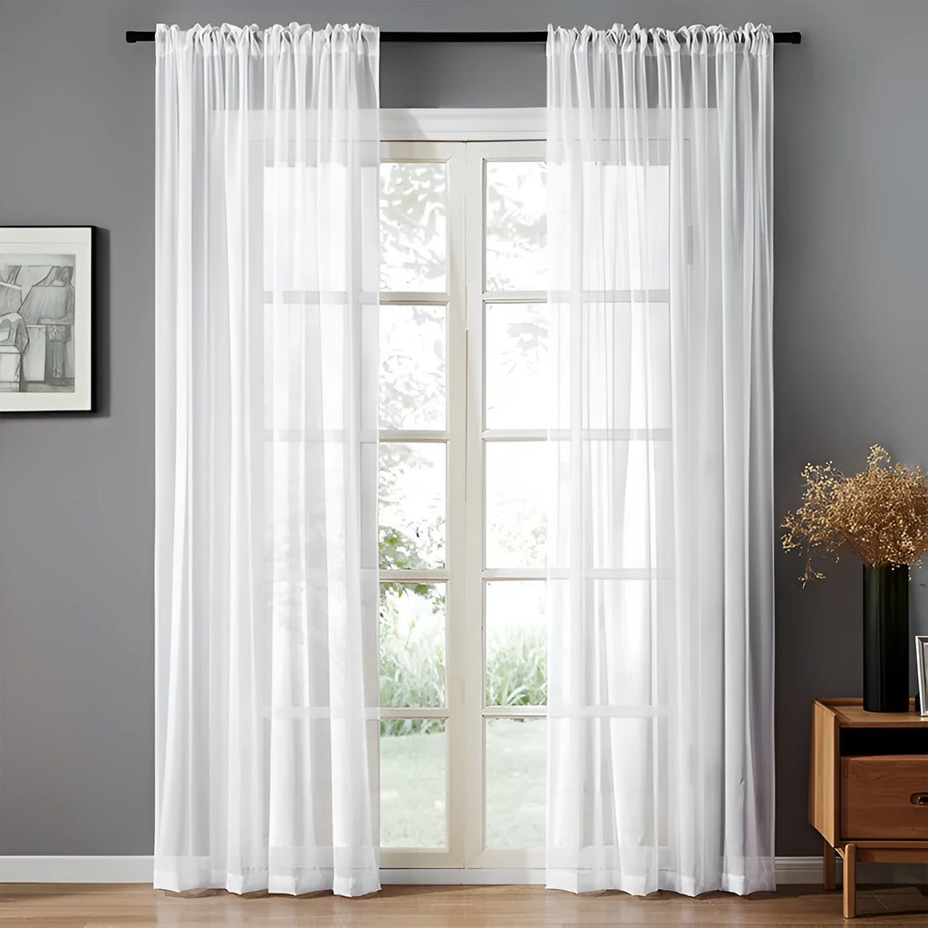Modern simple black cotton linen vertical perforated curtain hung on a window.