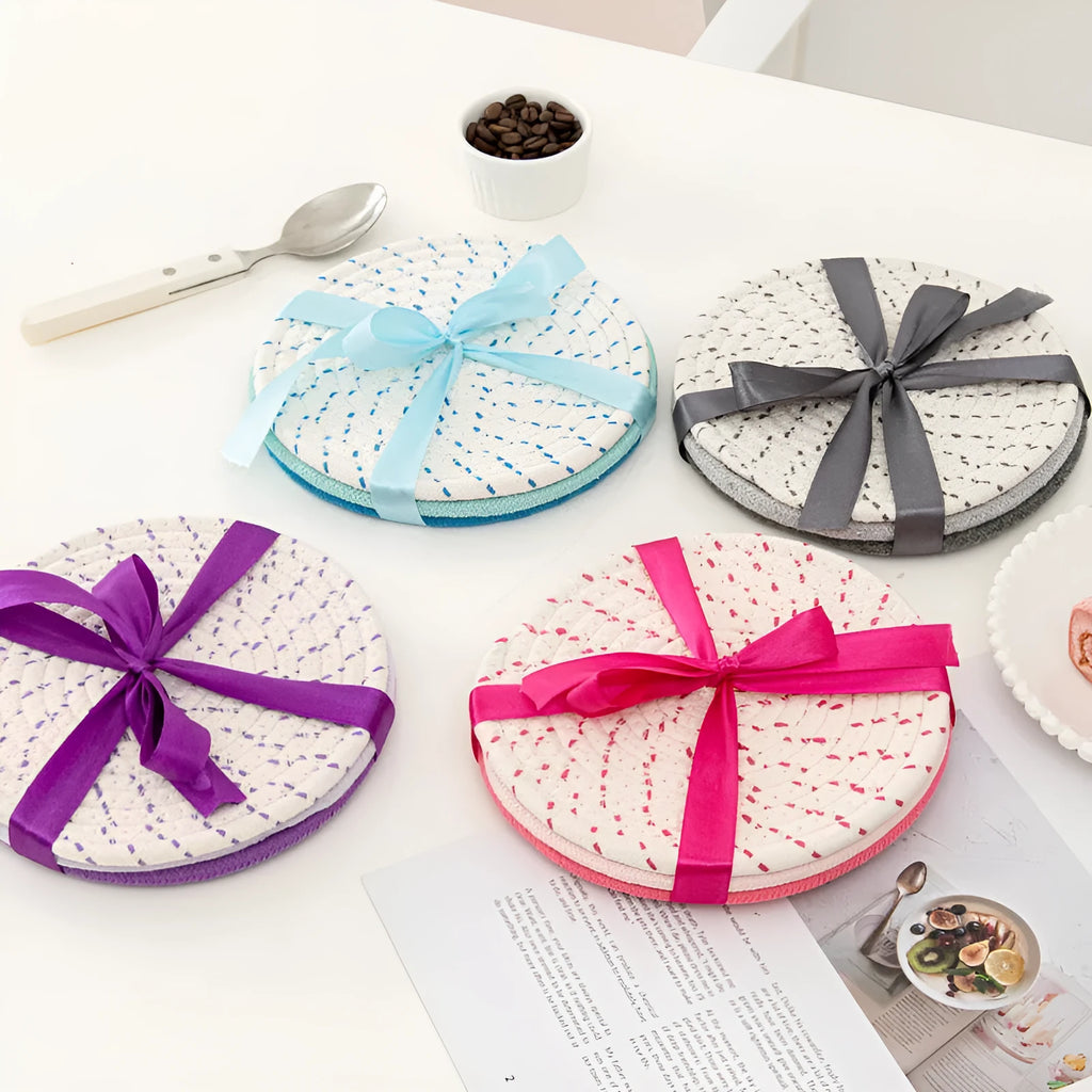 Three round 18cm cotton cord coasters in a set, shown in a blue colour option.