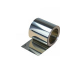 Close-up of thin 304 stainless steel sheet with leather backing on a car interior trim piece.