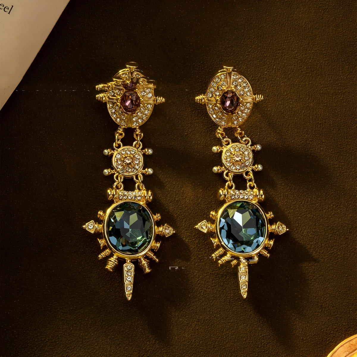 A pair of gold-coloured geometric round stud earrings with a retro style and diamond-treated alloy finish.