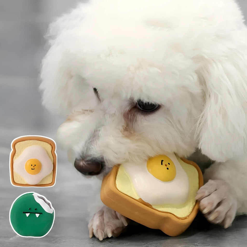 Yellow latex dog chew toy shaped like cartoon bread with egg pattern design