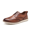 Men's black and brown slip-on business casual shoes with round toe and carved detailing