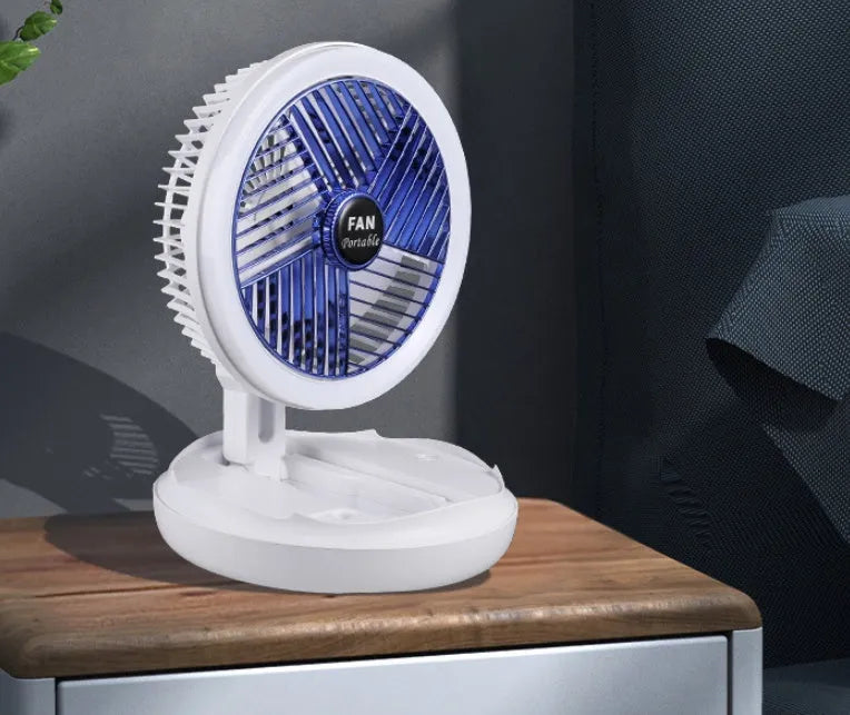 Blue foldable USB desk fan with LED light showing adjustable head and pen holder