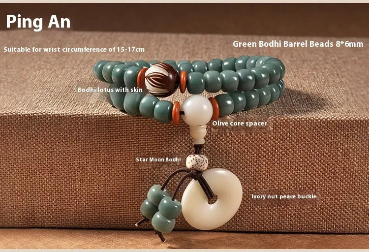 White and green beaded bracelet with a double ring safety buckle and a prominent double ring lotus bead decoration.