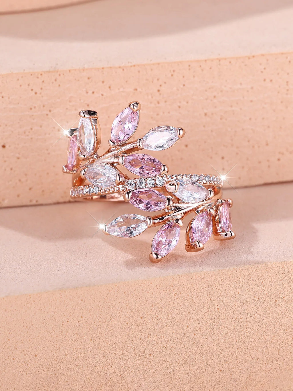 Adjustable horse eye zircon leaf ring in rose gold or platinum plating on a model's hand.