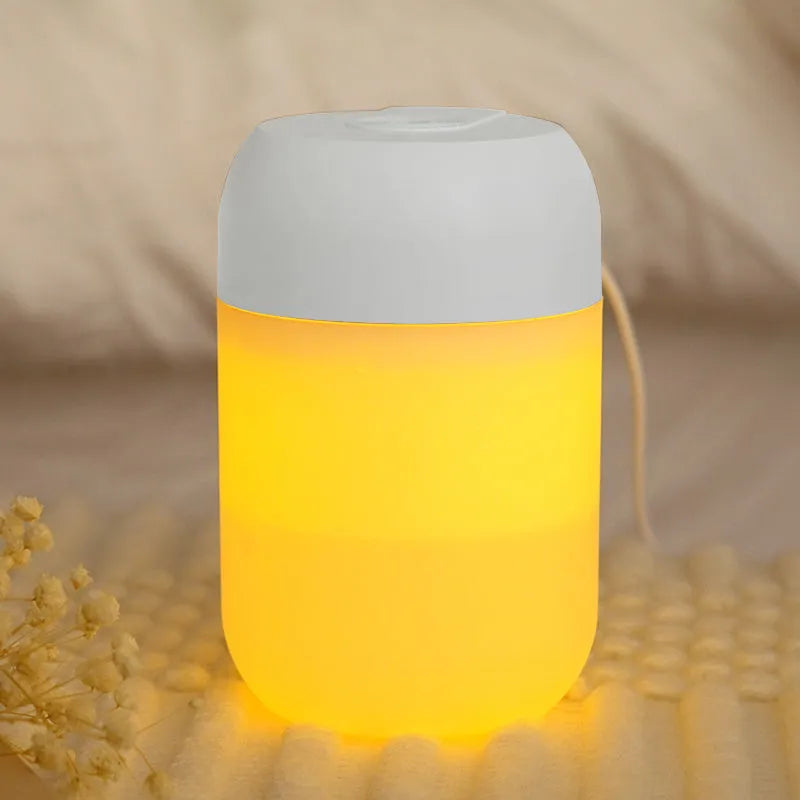 Small white cylindrical USB-powered humidifier on a desk