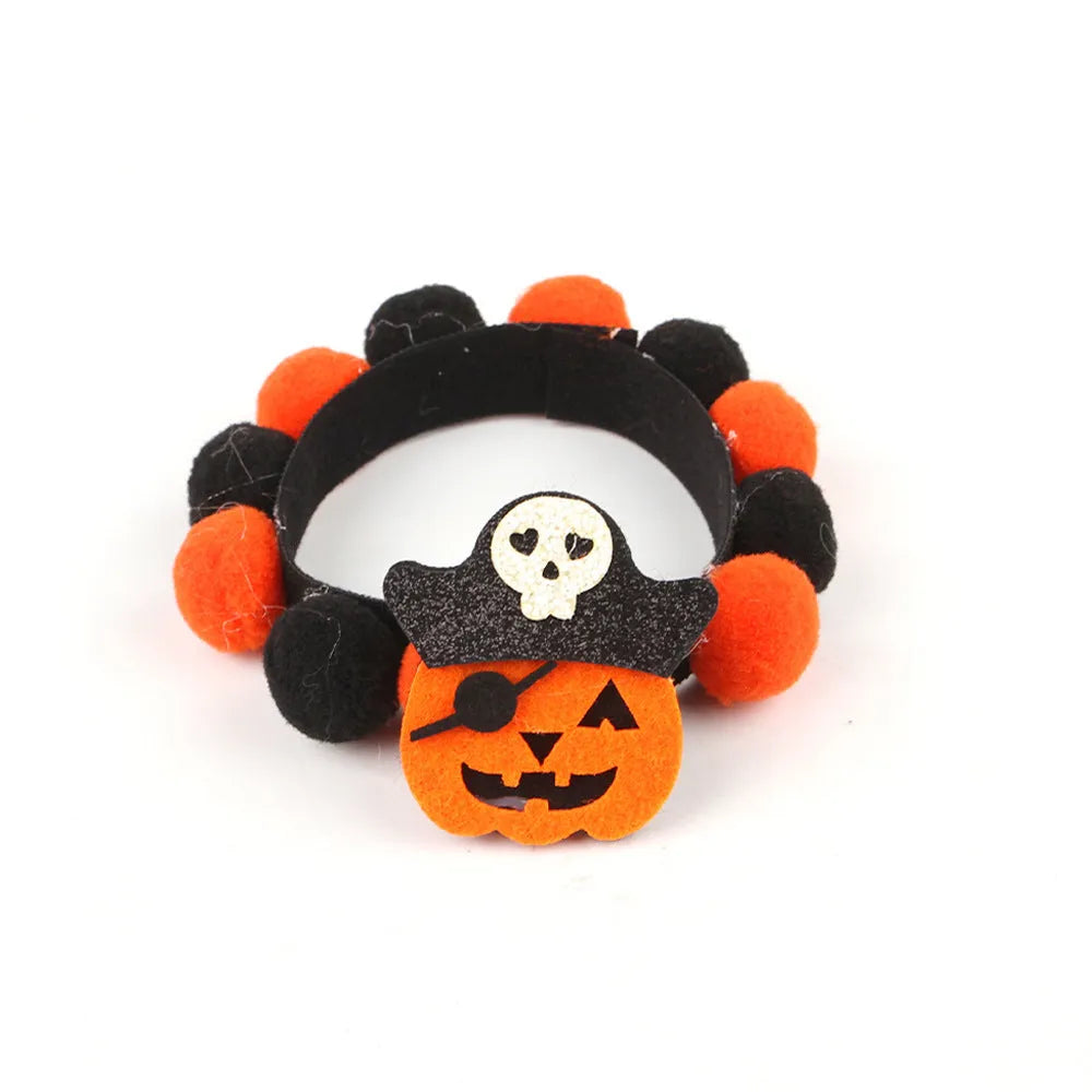 Halloween pet collar with decorative fur ball in pumpkin, bow, skull, and witch designs