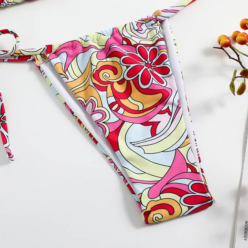 Women's triangle printed bikini set with halter neck top and separate bottom in multicolor pattern