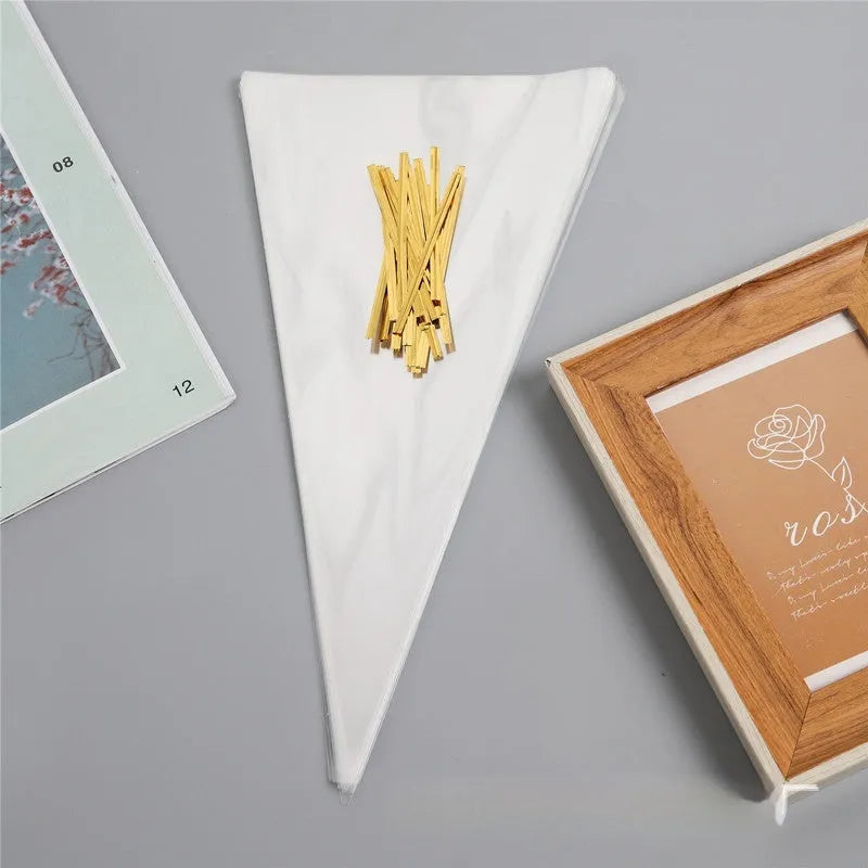 Transparent triangle-shaped plastic packaging bag with a twisted wire tie closure.