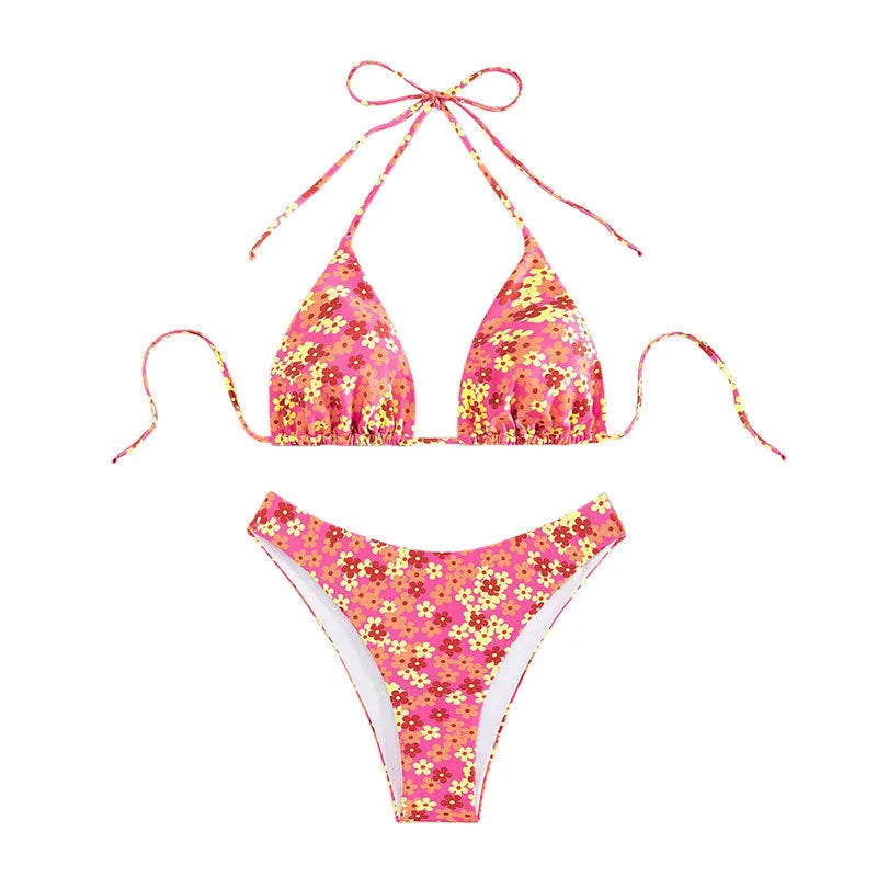 Women's blue floral print two-piece swimsuit with lace-up front and side-split shorts