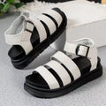 Black outdoor sandals with a thick rubber sole and adjustable buckle strap over the foot.