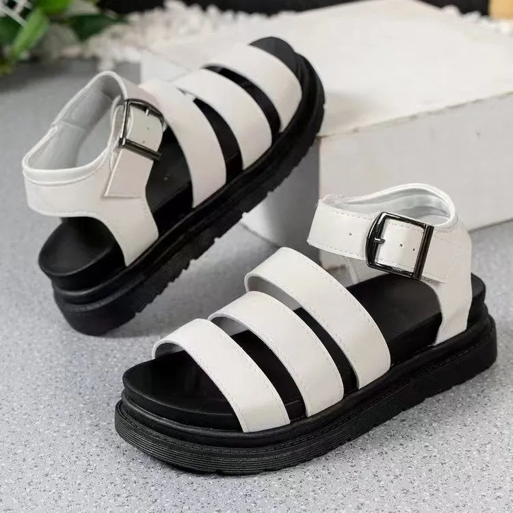Black outdoor sandals with a thick rubber sole and adjustable buckle strap over the foot.