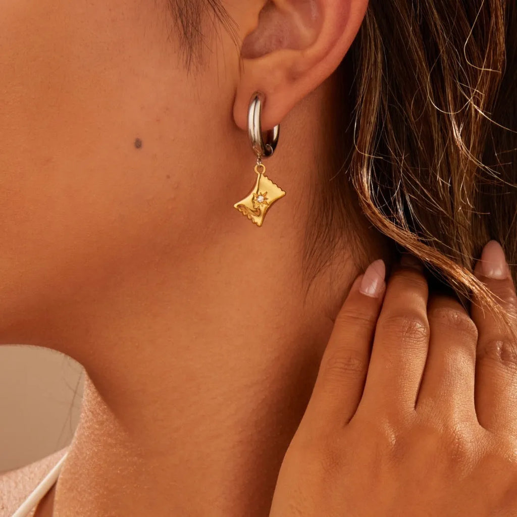 Christmas tree heart earrings in stainless steel with 18K gold plating showing heart and star shapes