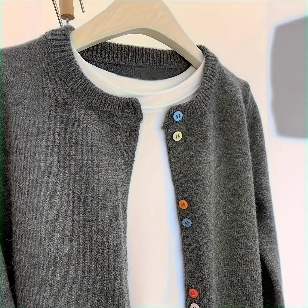 Dark grey women's button-front cardigan sweater with long sleeves on a hanger.