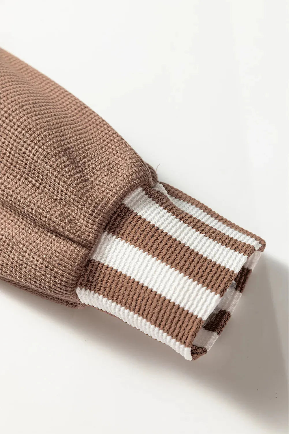 Straw yellow waffle texture hoodie with striped patchwork design, button neck, and drawstring hood.