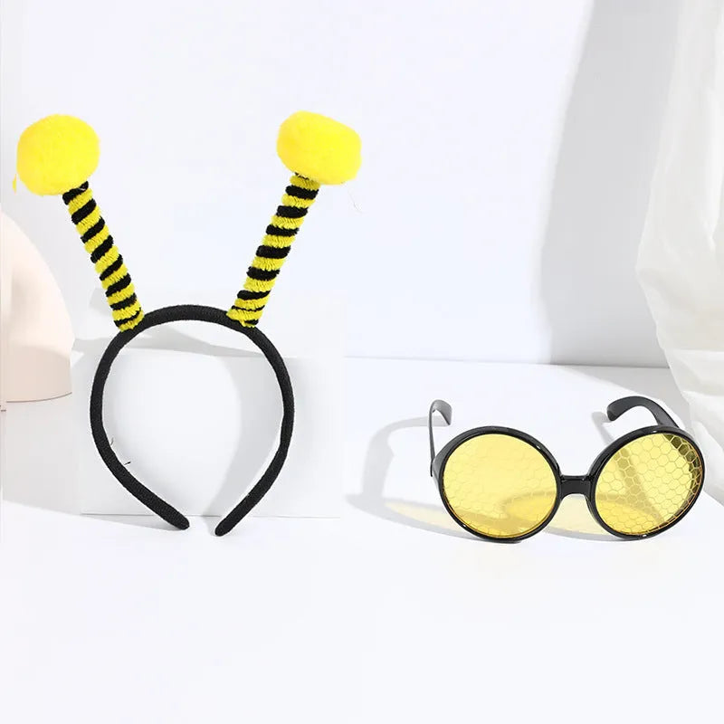 Yellow bee costume headband and matching glasses set on mannequin display
