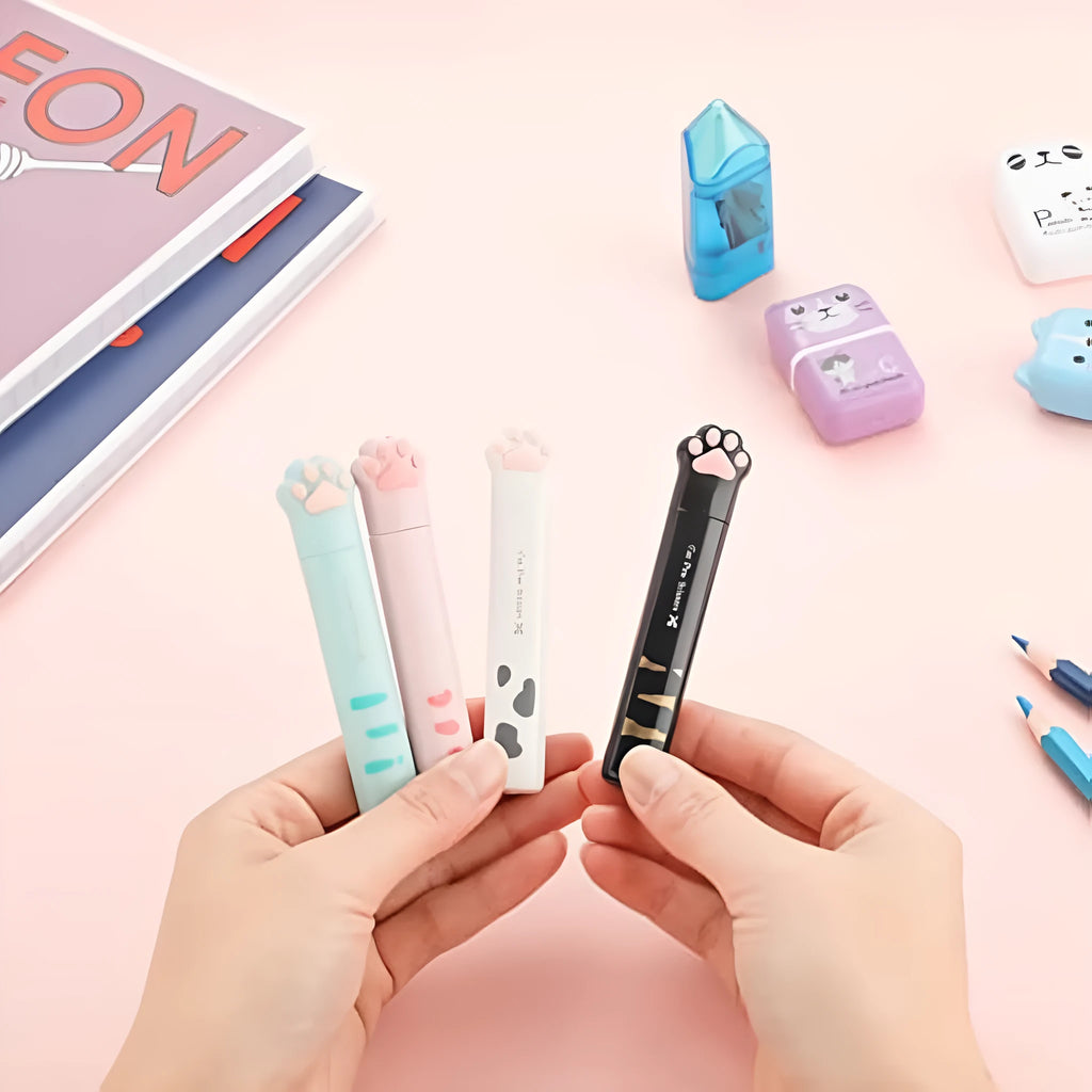 Closed and open views of cute cat paw design mini folding scissors in various colours.