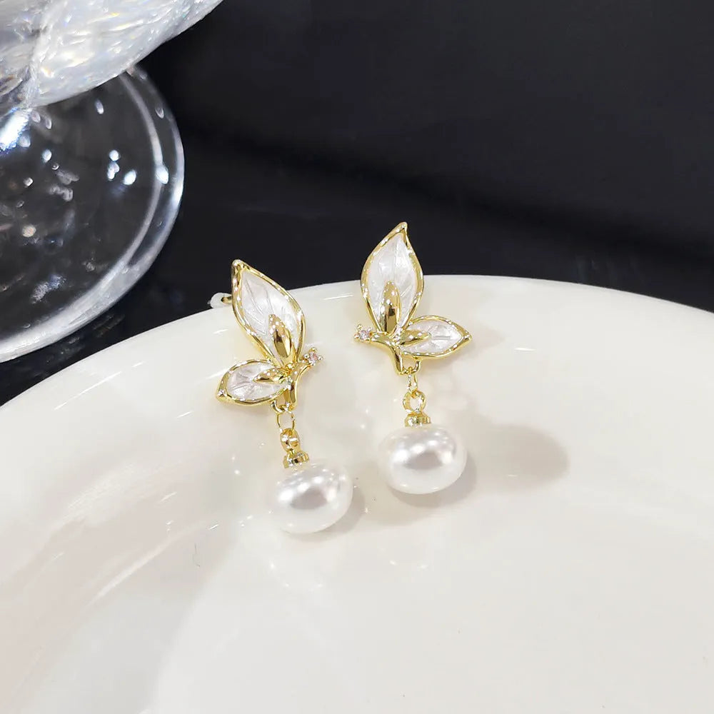 Copper butterfly earrings with zircon painting detail and electroplated metallic finish