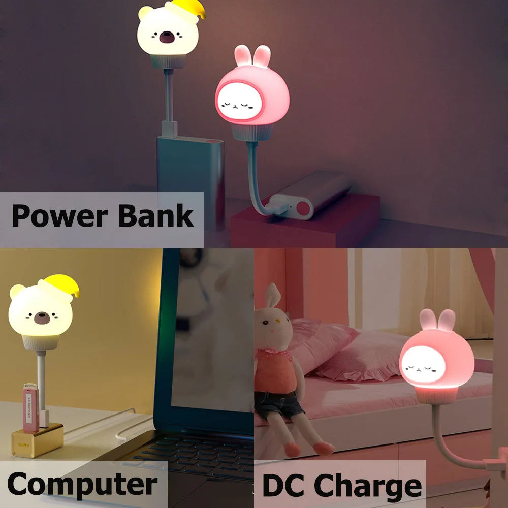 Cartoon animal USB night light with remote control on a bedside table.
