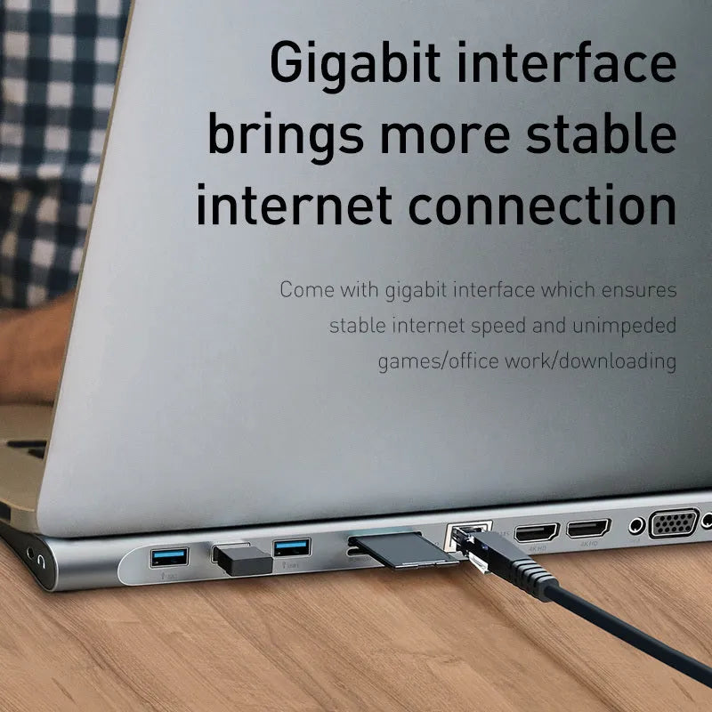 Grey aluminium ten-port USB hub docking station with cooling bracket on a desk.