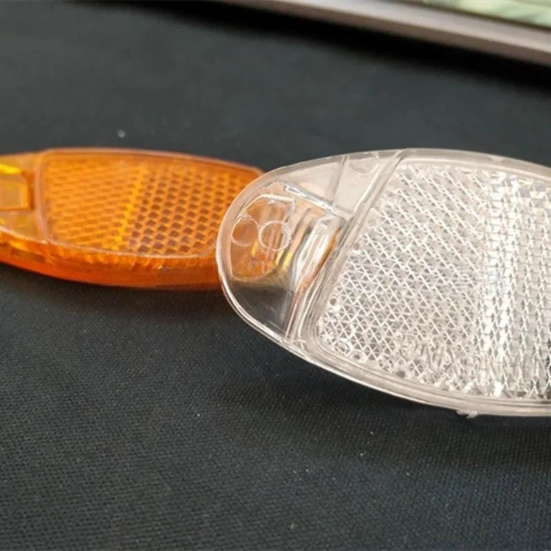 White and yellow bicycle reflector spoke decorations for front and rear wheels