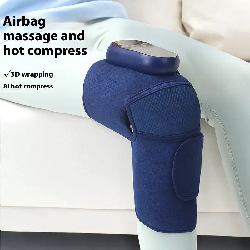 Blue self-heating knee massager wrap with adjustable straps, showing control panel.