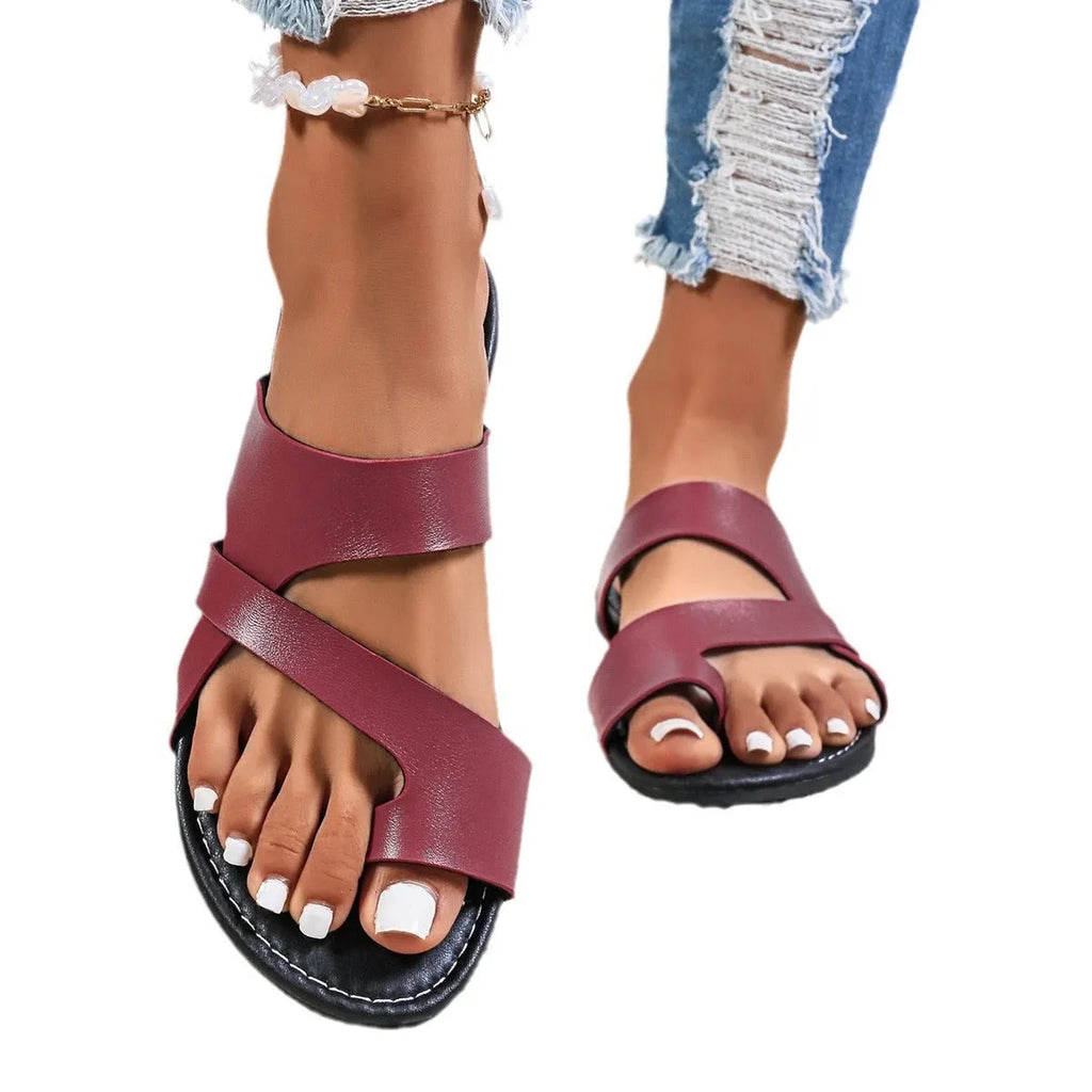 Casual round head beach slippers with a hollow out PU upper and leather lining.