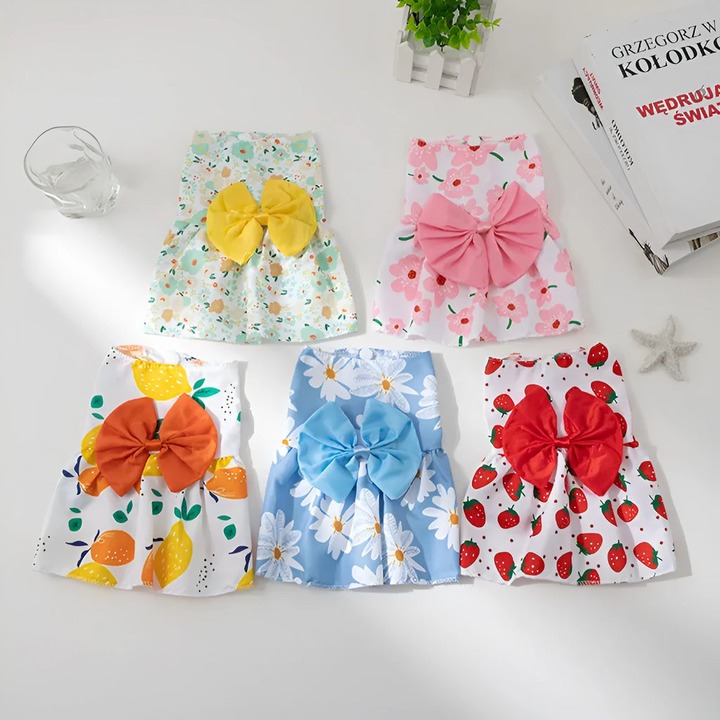 Orange bow summer pet dress with floral butterfly pattern on a dog, showing princess-style thin polyester construction.