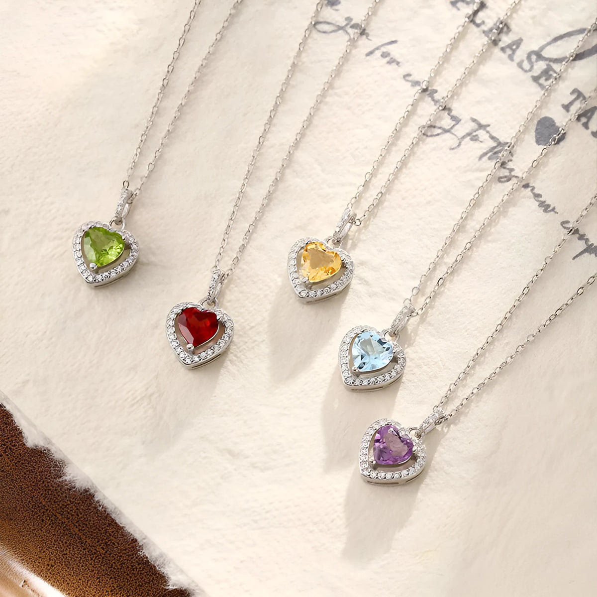 Women's sterling silver heart necklace with natural gemstone in five colour options on cross chain