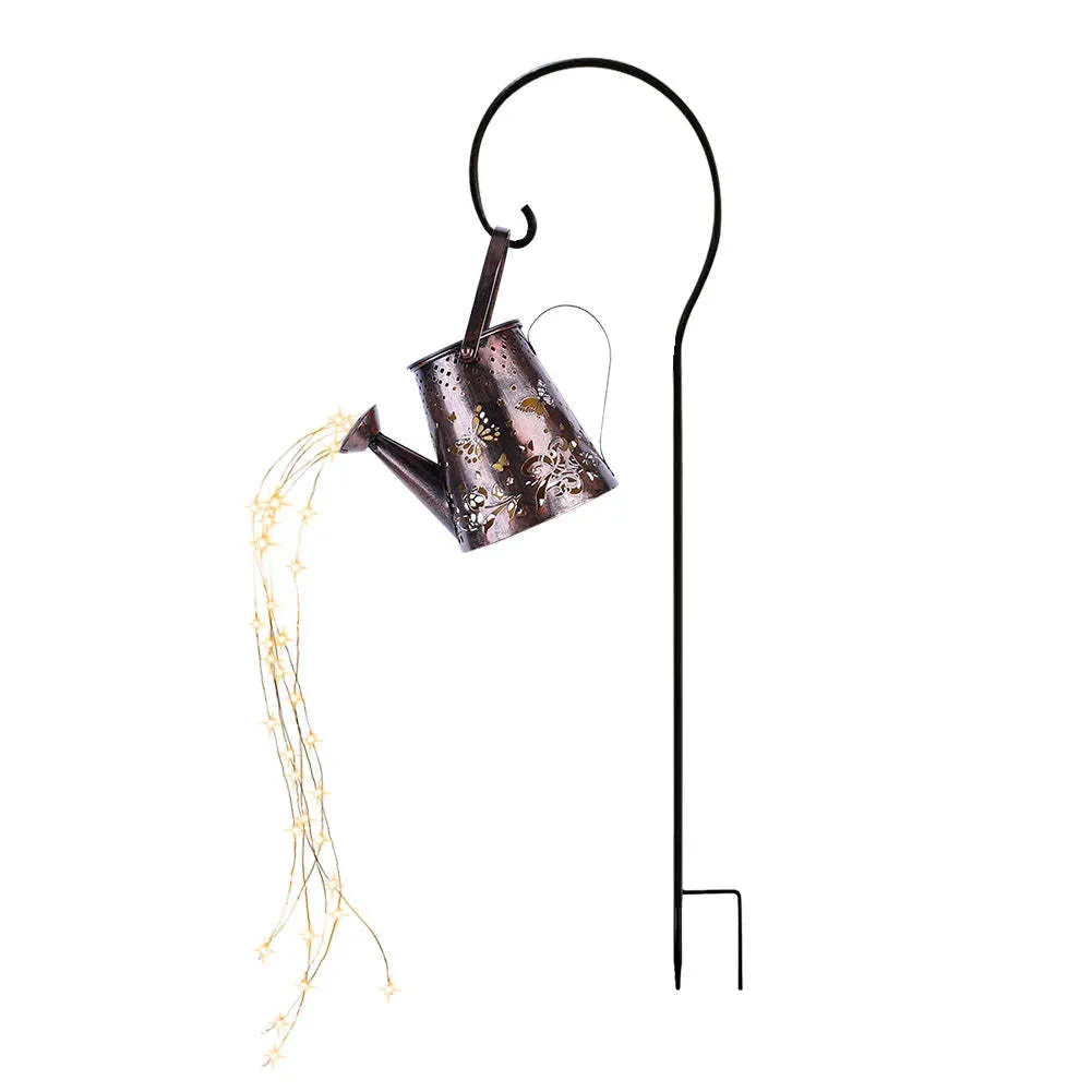 Tapered iron solar garden lamp with butterfly pattern emitting warm white light in a courtyard setting