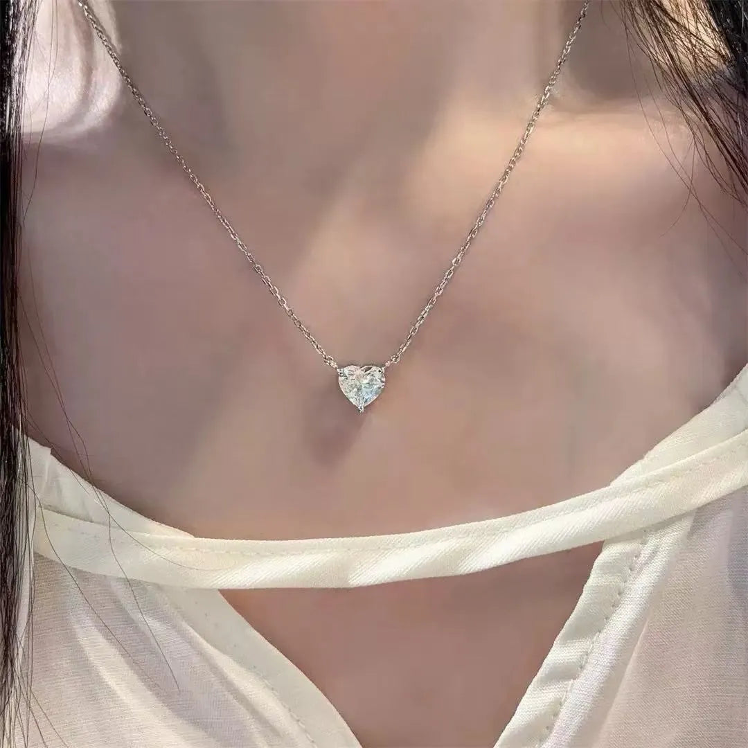 Silver-colour women's necklace with heart-shaped pendant in simple refined style